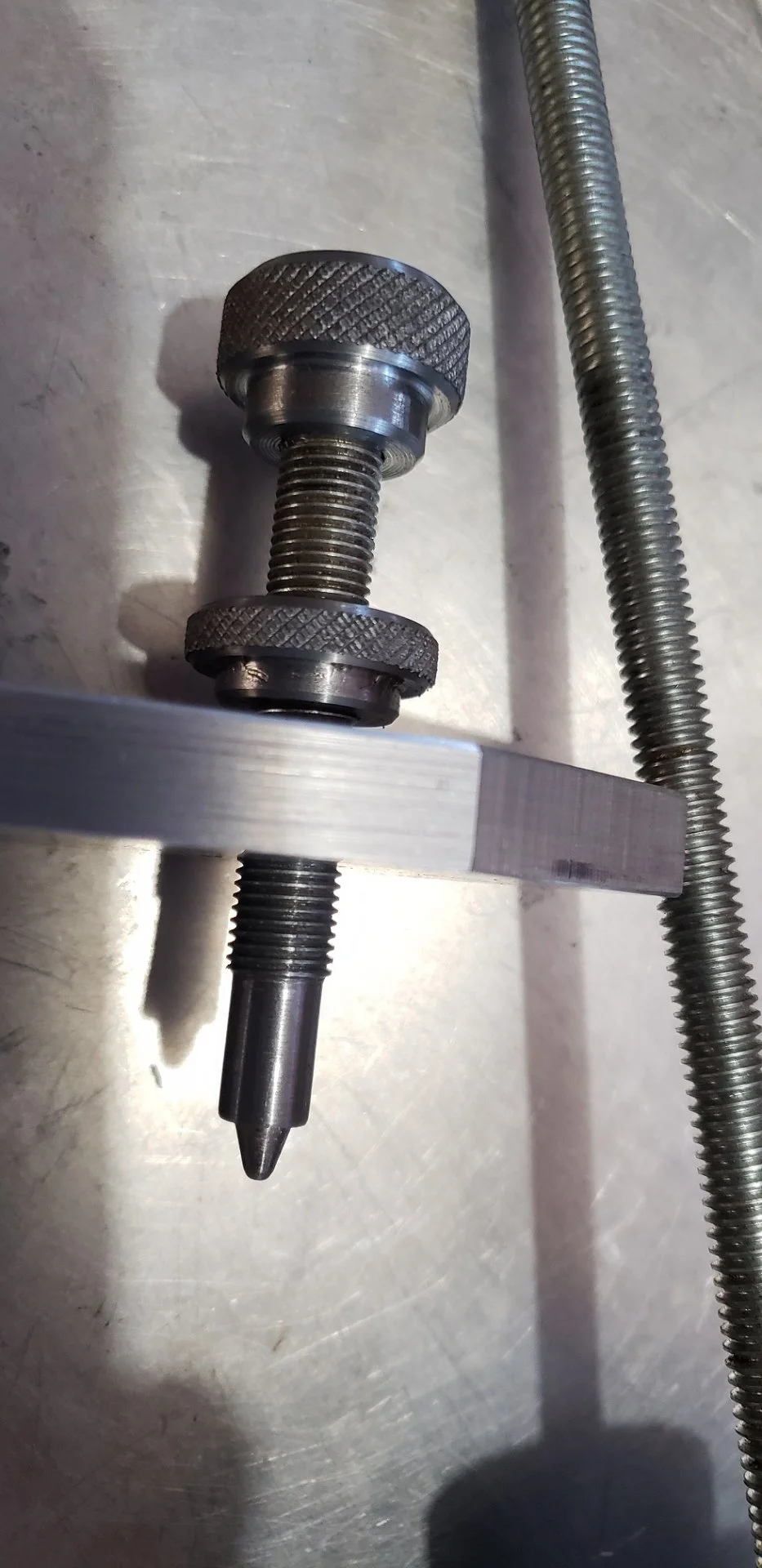 Indexing screw and knurled nuts.webp