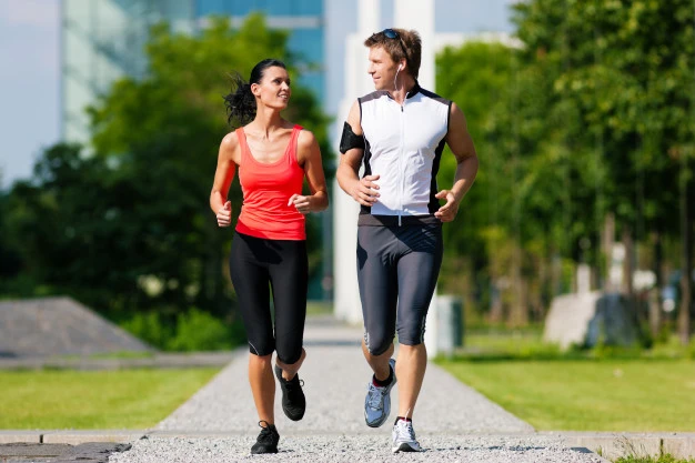man-woman-jogging-fitness-city_79405-11854.webp