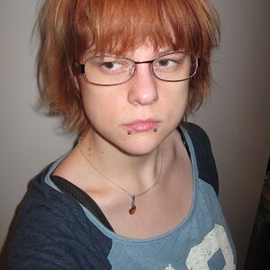 Me with washed out red hair. It annoyes me that my necklace is where it's supposed to be.