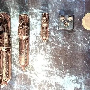 Size comparison.It's 1/1200th scale. The euro coin is 23mm, which is about 0.9 inches for you american folks