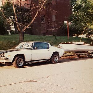 '75 Camaro for sale and my 1960 Crosby 14 foot runabout nearly finished circa 1983