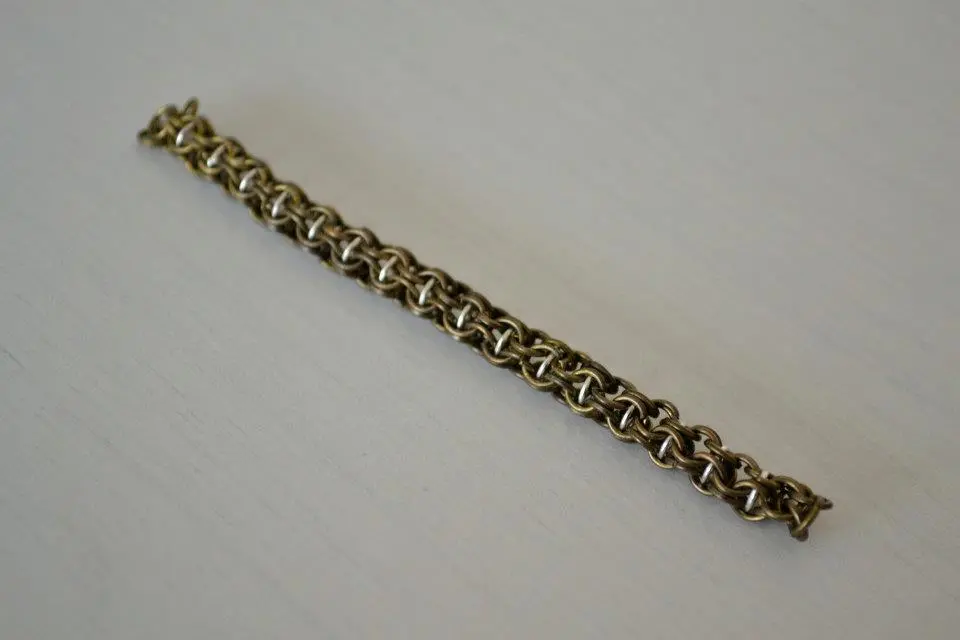 antique bronze and silver plate inverted captured roundmaile