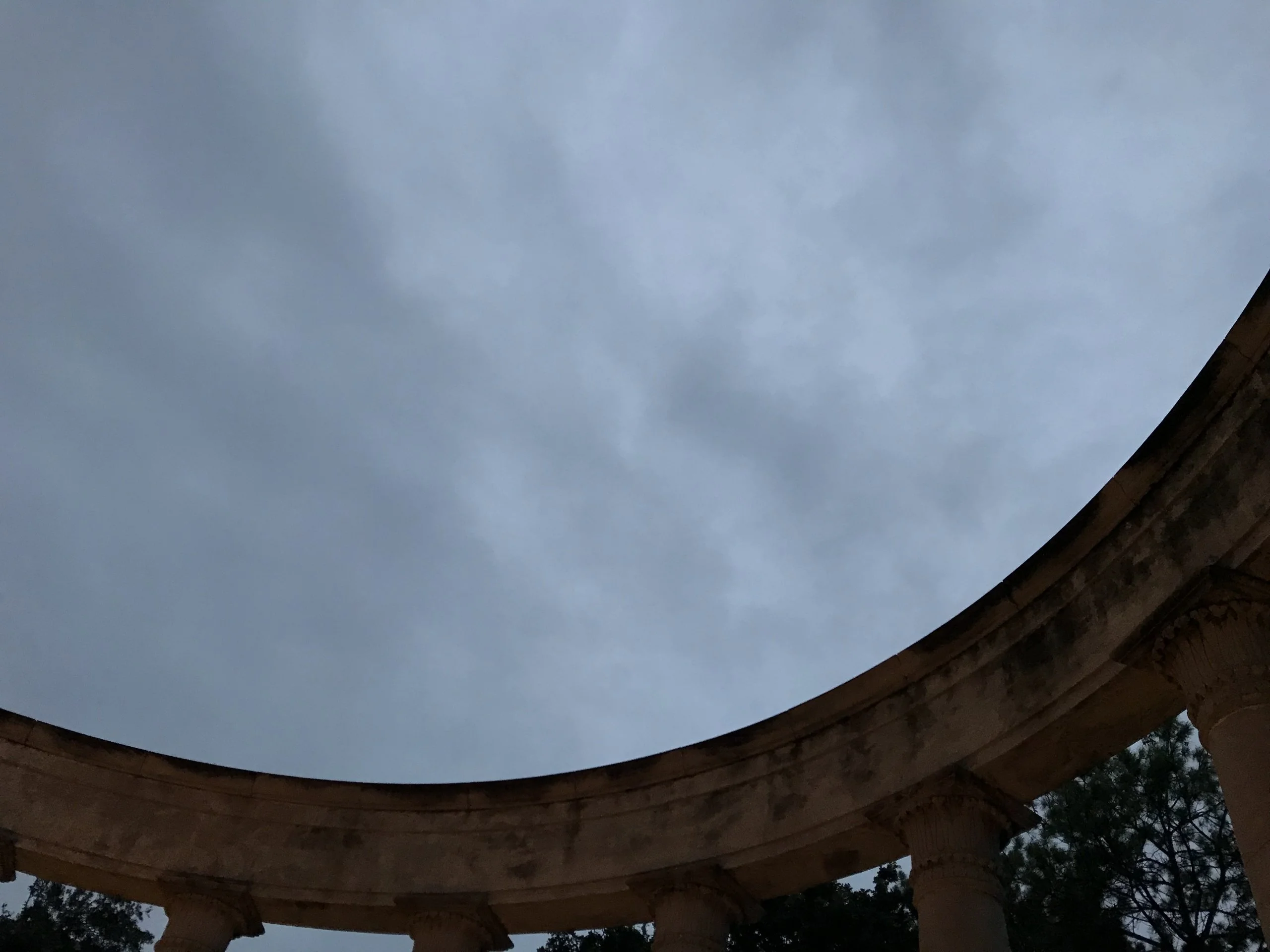 At the fountain under cloudy sky