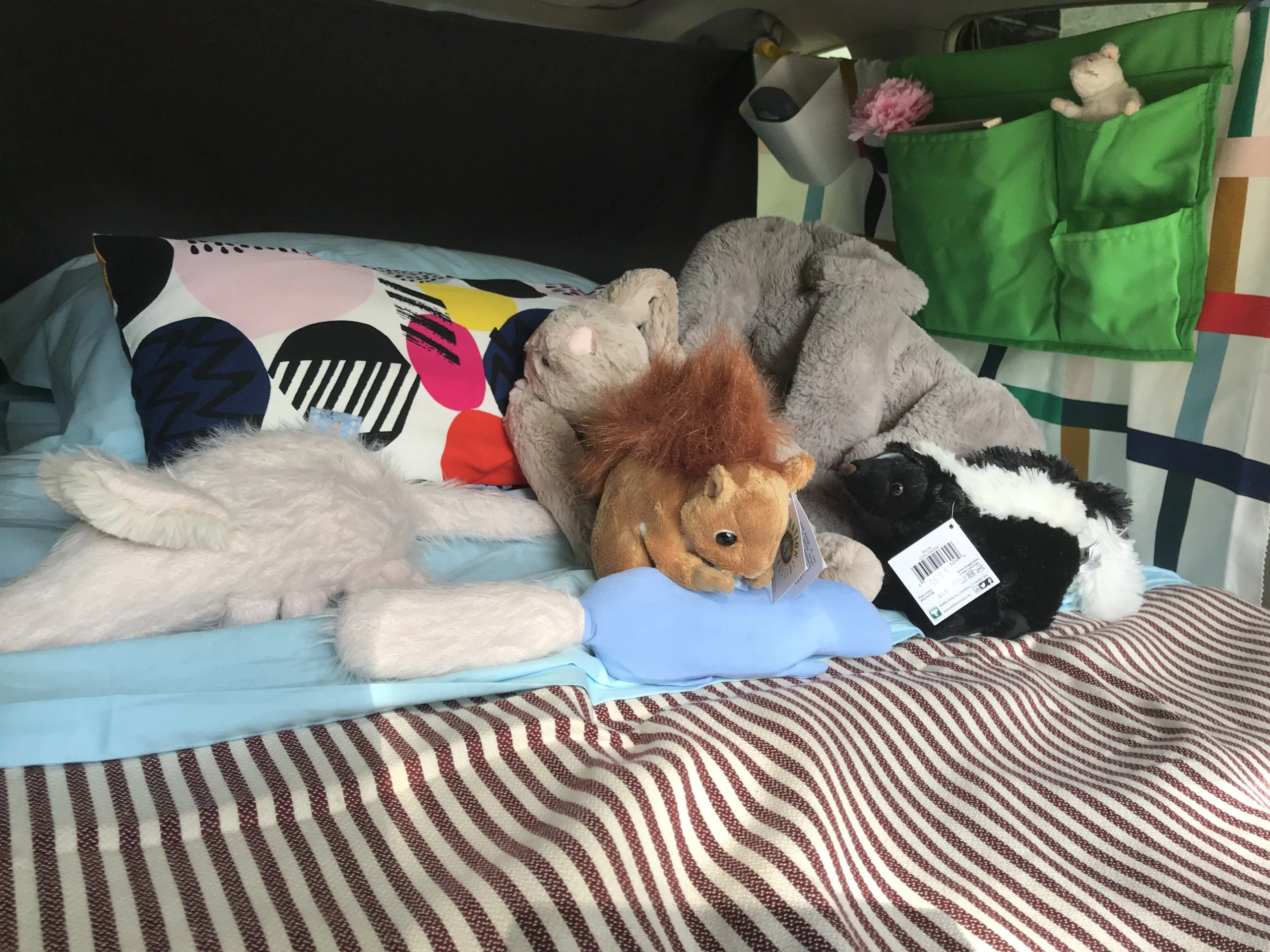 Green pocket for books, pens, chargers, and my little friend