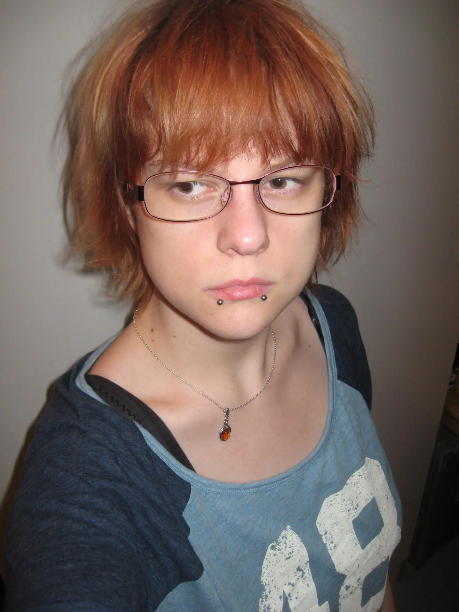 Me with washed out red hair. It annoyes me that my necklace is where it's supposed to be.