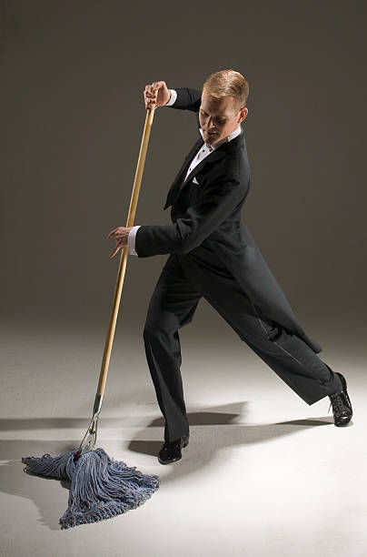 man-in-tuxedo-dancing-with-mop.jpg