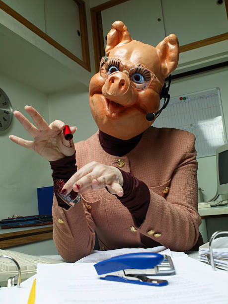 telephonist-wearing-plastic-pig-mask-painting-fingernails-at-desk.jpg