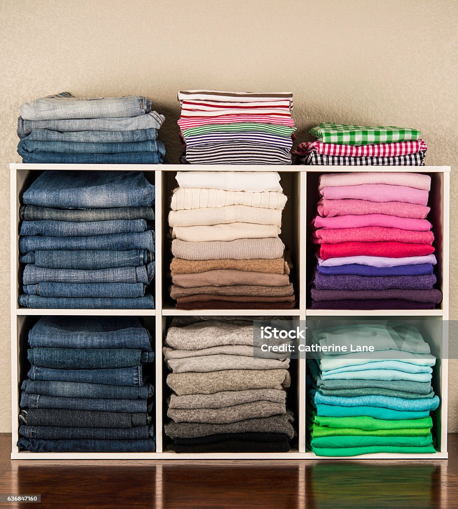 neatly-organized-womens-clothing-in-white-cubicles.jpg