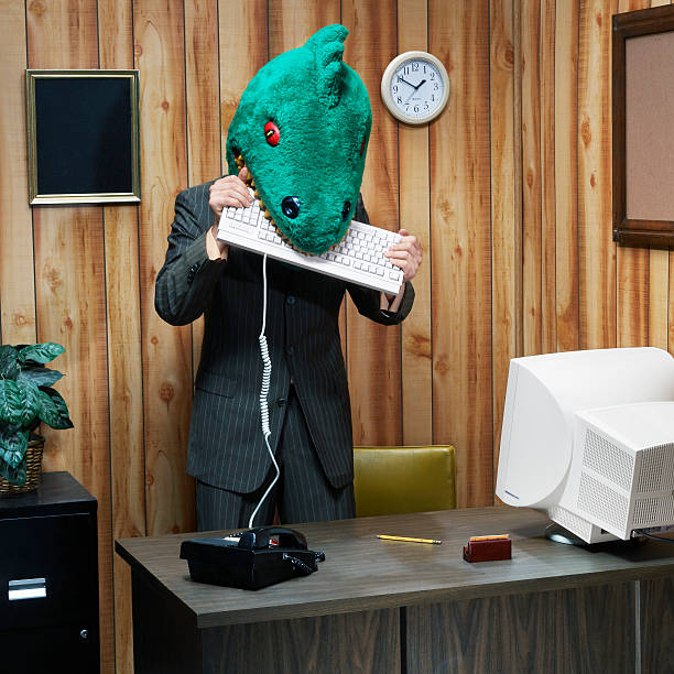 dinosaur-in-office-eating-computer-keyboard.jpg