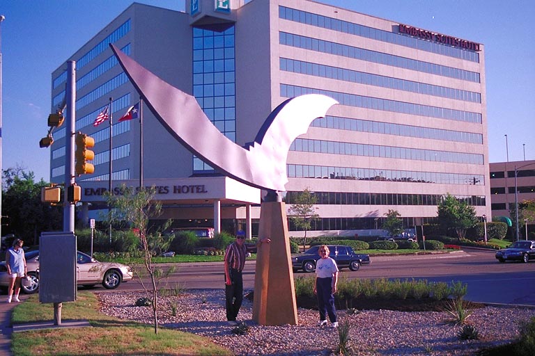 mom_and_dad_with_bat_sculpture.jpg