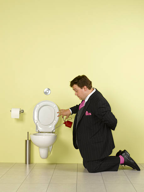 obsessive-business-man-oiling-toilet.jpg