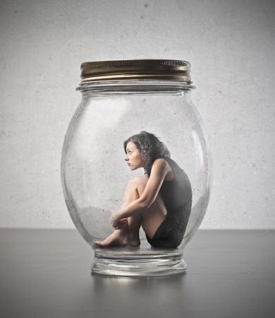 13037632-young-woman-trapped-in-a-glass-jar.jpg