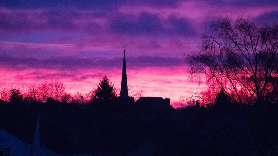 Purple skies seen across England with sunrises - BBC News
