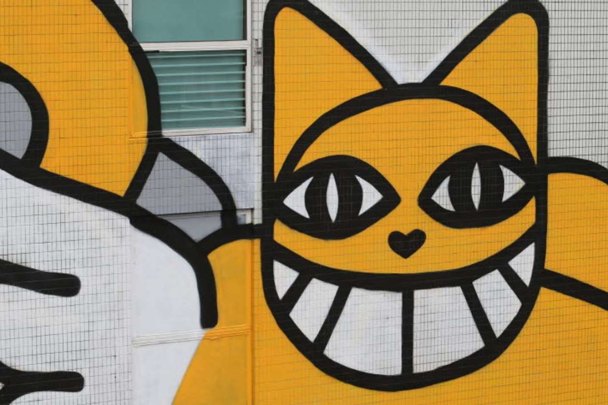 Graffiti artist M. Chat completes giant mural of grinning yellow cat on  side of Hong Kong hotel | South China Morning Post