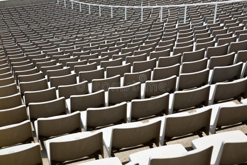 stadium-seats-field-empty-32601857.jpg