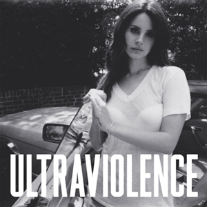 A black and white photo of a fair-skinned, dark-haired woman wearing a sheer white V-neck T-Shirt and a white strapless bra, standing beside a car. Her hand is resting on the opened left car door and the word Ultraviolence, stylized in all capital letters, is placed on the lower part of the picture.
